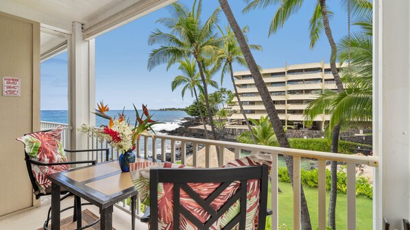 Overlooking a tropical lagoon towards the bay and the light house far off in the distance.