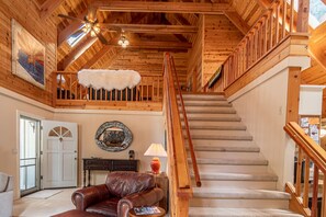 Looking upstairs into the loft, large wide staircase