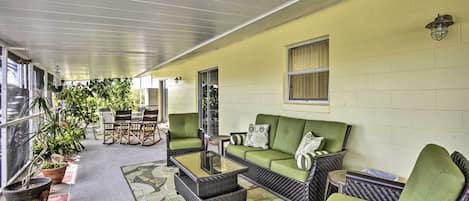 Soak in the warm weather via this screen-in porch!