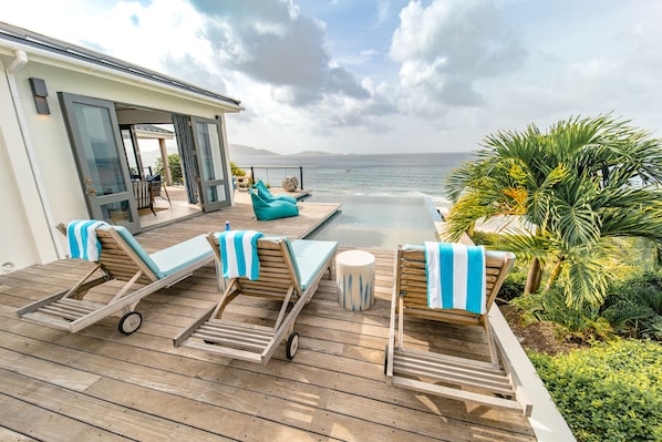 The Beach House pool deck with ocean views