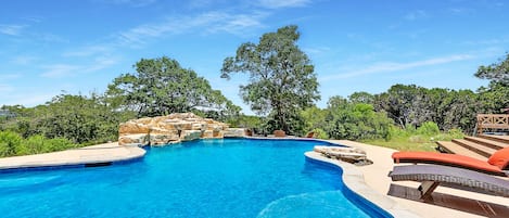 Sparkling blue pool with gorgeous Hill Country views