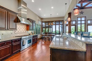 Large kitchen with granite countertops and stainless steel appliances