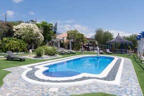 View of terrace set in tropical gardens