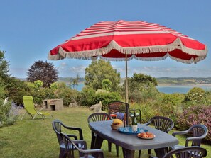 Table, Sky, Furniture, Plant, Umbrella, Property, Water, Chair, Nature, Shade