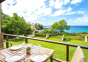 From this tranquil lanai, take in the layered beauty of gardens, pool, and ocean stretching endlessly to the horizon NAP-C43