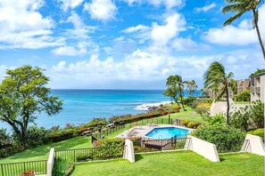 Wake up to sweeping ocean views, lush tropical gardens, and peaceful poolside serenity from your private lanai perch     NAP-C43