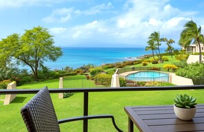 Dine alfresco overlooking a vivid tapestry of green gardens, sparkling sea, and the soothing curves of coastal cliffs NAP-C43
