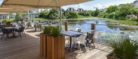 Table, Water, Plant, Sky, Furniture, Property, Umbrella, Chair, Shade, Outdoor Furniture