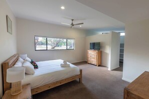 Wake up to peaceful bushland views in the spacious main suite, complete with a walk-in robe, ensuite and calming neutral tones.
