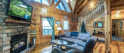 Exposed beams and large picture windows really define the elegance of your cabin