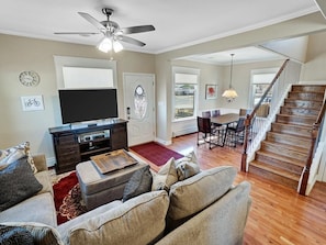 Stairs lead to a loft master bedroom.