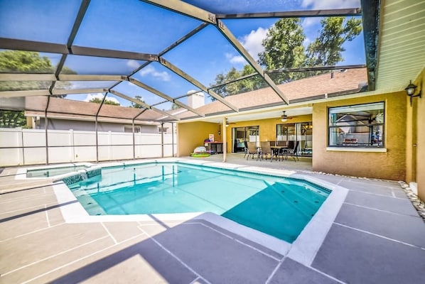 Lounge on the spacious patio by the pool