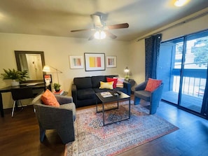 Modern meets vintage in this stylish living room. Enjoy comfortable seating and plenty of natural light.