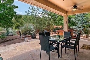 Backyard with hot tub and fire pit