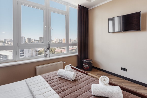 Large bedroom with bed and orthopedic mattress.