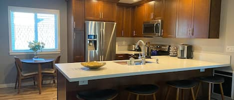 Kitchen area with beautiful counter top.