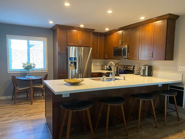 Kitchen area with beautiful counter top.