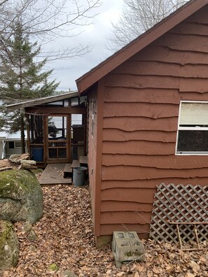 View of the back of the camp with the enclosed porch off the side