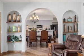 family room looking into dining and kitchen area.