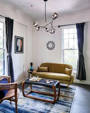 Stylish, bright, and full of art, you'll love this modern one bedroom. Perfect for a quick getaway, you'll love lounging in the sleek living room while you overlook Eden Brae's historic heron fountain and front gardens.