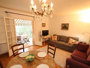 Lounge and dining area leading to large balcony/terrace