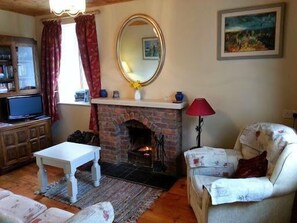 Living area. Relax in our cosy living room with a turf fire.