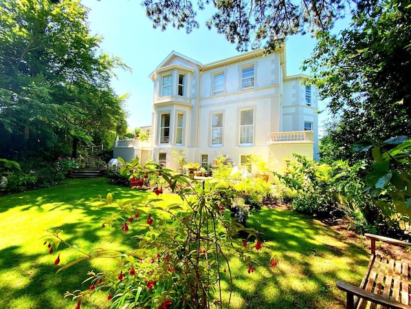 Garden. Muntham Apartment 5 - overlooks The Rose Garden at the side of the property.
