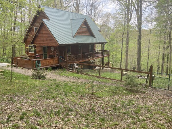 Fenced yard with Fire pit.