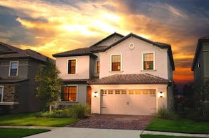 Beautiful twilight shot of the front of your vacation villa.