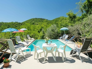 Sky, Furniture, Table, Plant, Umbrella, Chair, Outdoor Furniture, Swimming Pool, Outdoor Table, Shade