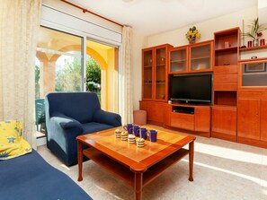 Furniture, Room, Living Room, Property, Interior Design, Orange, Building, Table, Coffee Table, Yellow