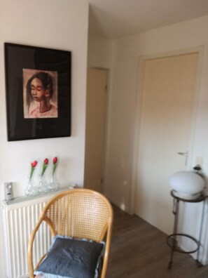 Living area. Hall with toilet and spiral staircase