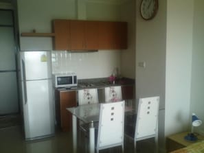 Eating seating and fridge, freezer, stove and microwave oven