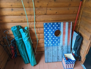 Director's chairs for the beach, Cornhole games , and charcoal grill ♨️