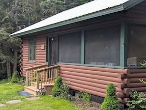 Enjoy the cool salty air on the porch and listen to rain on the tin roof !