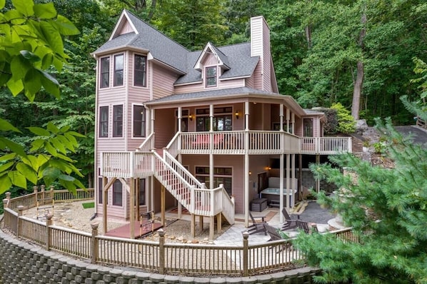 Perched on Bald Mountain like a mini castle! Enjoy the wraparound porch, outdoor patio, and cozy chimney—all with epic mountain vibes.