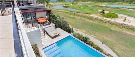 View of the ocean and golf course from main porch of the pool and Guest bedroom