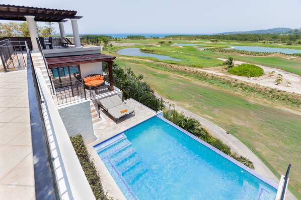 View of the ocean and golf course from main porch of the pool and Guest bedroom