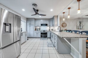 View of kitchen from foyer entry