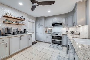 Another kitchen view with fully equipped coffee bar