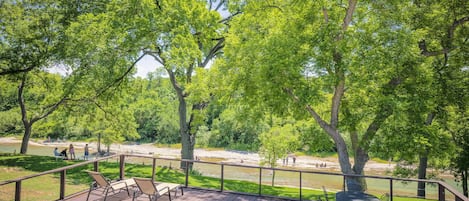 Spacious back deck overlooking the cool Guadalupe River