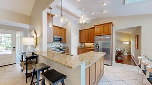 Fully Stocked Kitchen with Bar Seating