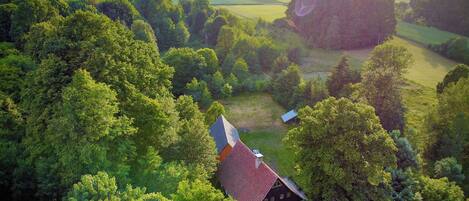 House and barn in the foothill of the Ostryca (Spitzberg) volcano 501m
