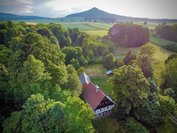 House and barn in the foothill of the Ostryca (Spitzberg) volcano 501m
