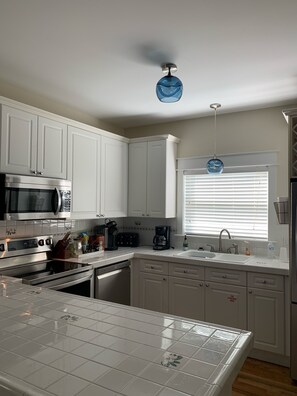 Kitchen with all updated appliance that is well equipped. 