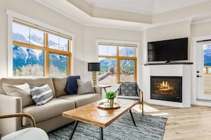 Cozy living room with gas fireplace and brand new Smart LG TV