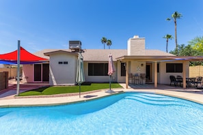 Heated & cooled pool with plenty of outside seating for the whole family.