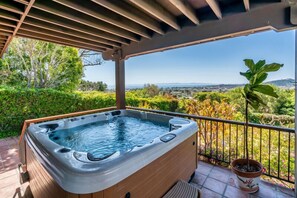 Enjoy the view as you soak in the extra large spa on the lower deck!