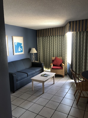 Dining and living area with sofa bed