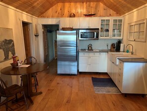 Kitchen and full size frig with ice maker